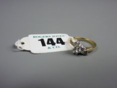 An eighteen carat gold trefoil diamond set ring with diamond set tail, approximate diamond