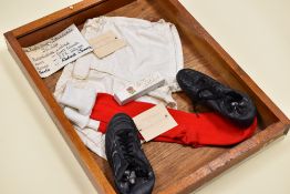 A PRESENTATION CASE OF WELSH RUGBY UNION INTERNATIONAL MATCH-WORN APPAREL TO COMMEMORATE 50 x CAP