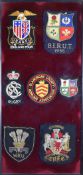 FRAMED PRESENTATION OF SEVEN CLOTH BADGES INCLUDING 1955 BRITISH LIONS RUGBY UNION TOUR BLAZER
