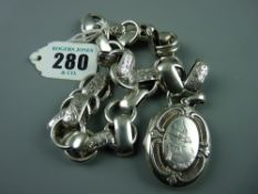 An oval silver photo locket having a plain back and the front with a shaped and scrolled border with