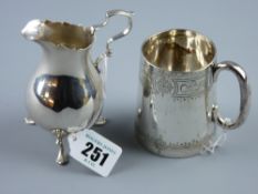 A silver cream jug with crimped rim, narrow neck, three shell and web supports, 2.2 ozs, London 1893