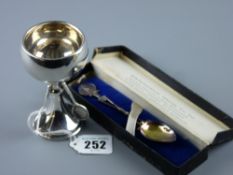 A circular based silver tennis trophy, the column supported by three tennis racquets, 1.6 ozs,