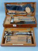 Two mahogany cased sets of surgical instruments by Down Brothers, London including a bone doctor's