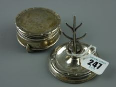 A circular based silver ring tree, Birmingham 1915 and a circular silver ring box on three short