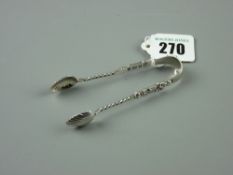 A pair of silver sugar nips with shell bowls, twist column with figural top, Birmingham 1902