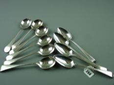 A set of four fine silver serving spoons, the tapered handles with lined edges and monogrammed