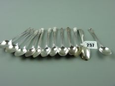 Coffee spoons - a set of twelve silver coffee spoons with scrolled decorated handles, 4.5 ozs,