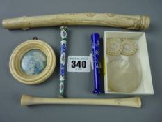 A 19th Century painting of a lady on ivory slip within an ivory circular frame, a carved parasol