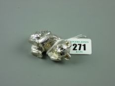 A Christofle white metal reclining bear with pierced pattern hollow body, marked to the base '