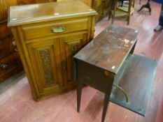 An Edwardian oak side cabinet with moulded top over a single frieze drawer and carved panel cupboard