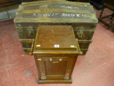 A dome topped vintage travel trunk with wood and iron banding and an oak twin handled coal bin