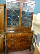 A William IV two piece mahogany bookcase secretaire having twin thirteen panel astragal glazed upper