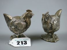 A pair of Continental salt or pepper pots in the form of chickens with removable wing for filling, 6
