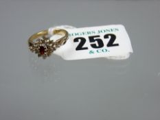 A 925 gold ruby and diamond cluster ring, Chester hallmark, having an oval centre ruby with ten