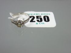 A white gold or platinum diamond solitaire ring, the centre solitaire diamond visual estimate 1.1