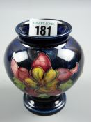 A Moorcroft Columbine cobalt blue ground squat vase, impressed factory marks to the base, 9.5 cms
