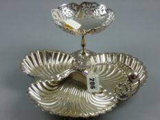 An electroplated three compartment shell shaped table server with double twist and scrolled handle