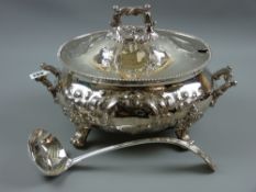 A fine quality heavy oval electroplated tureen having a feather edge rim with raised scrolled and
