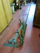 A Victorian cast iron horse drawn plough, the blade marked 'J & H Thomas, Foundry, Llanrwst', 320