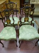 An excellent set of four (two and two) satin wood silvered and ivory inlaid mahogany chairs,