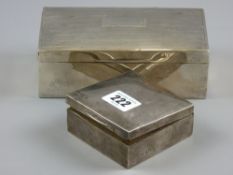 A square silver cigarette box, Birmingham 1929, 8.5 cms square and an oblong hallmarked cigarette