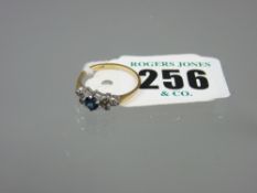 An eighteen carat gold amethyst and diamond dress ring having a centre round cut amethyst with three