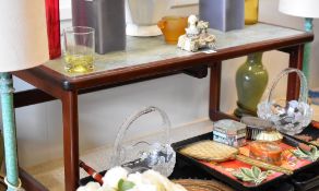 A nest of three circa 1970s hardwood and tile topped coffee tables