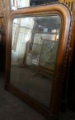 An arch framed wall mirror with pie crust rim