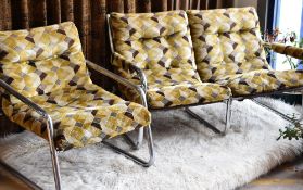 A 1970s stylish chrome two seater sofa and matching armchair in geometric velvet upholstery