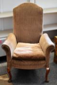 A stripe upholstered vintage armchair on cabriole supports