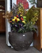 A large twin handled cauldron style flower vessel and sundry other potted plants