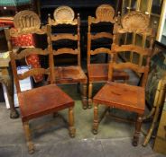 A set of four continental rail back chairs with shell finials and with leather seats