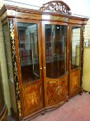 An impressive reproduction Italian style display cabinet having a carved open pediment, moulded