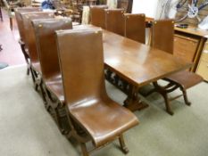 An excellent reproduction refectory style dining table with turned gallery stretcher and eight (