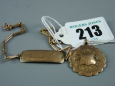 A nine carat gold initialled bracelet with tag and chain and a nine carat gold trophy pendant, 7.8