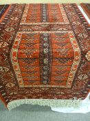 A 20th Century 100% pure wool Super Kershan runner with knotted fringes, red ground patterned carpet