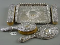 An excellent hallmarked silver rectangular dressing table tray with embossed floral and sea scroll