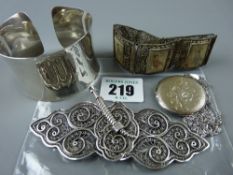 A lady's wristband stamped 925, a hallmarked silver circular locket with chased decoration and