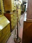 An early 20th Century mahogany standard lamp and shade and a vintage brass standard lamp and shade