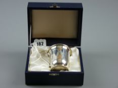 A modern hallmarked Sheffield silver presentation mug (boxed), inscription to front 'Eglwysbach