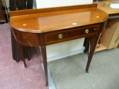 An Edwardian inlaid mahogany single drawer side table with bow sides and line inlaid tapering