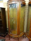 A reproduction mahogany effect demi-lune display cabinet, three bowed glass beaded edge panels
