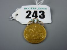 A 1908 gold half sovereign with scrolled mounts, 4.5 grms