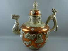 A substantial and very impressive Tibetan ceremonial tea kettle, copper body and lid with brass