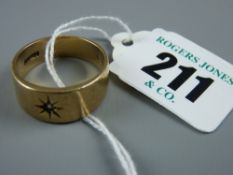 A nine carat gold gent's signet ring of graduated form with inset sunburst cz stone, 8 grms total