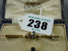 A nine carat gold bar brooch with three aquamarines and three pearls, 3.8 grms gross