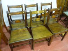 A set of six William IV dining chairs with shaped and carved centre splats and square tapered
