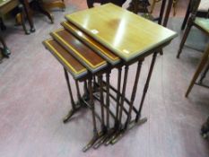 An Edwardian quartetto of mahogany and boxwood strung tables on spindle turned supports, splayed