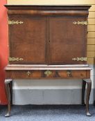 CABINET-ON-STAND having a long single base drawer on cabriole supports and with two cupboard doors