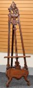 A LARGE DARKWOOD ORNATELY CARVED EASEL, 215 x 70 cms
